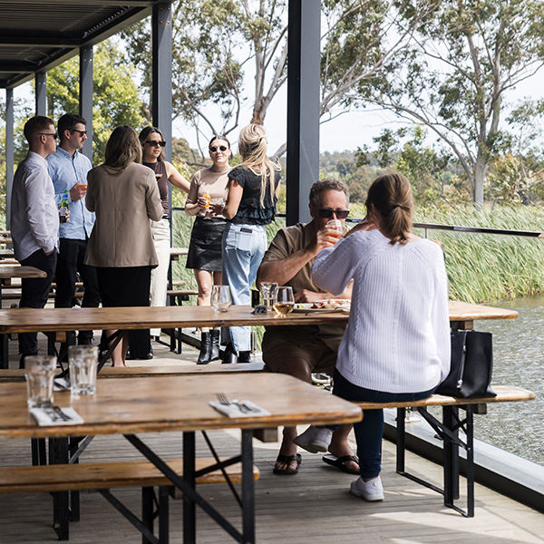 Guests enjoying Il Vigneto’s terrace overlooking the lake