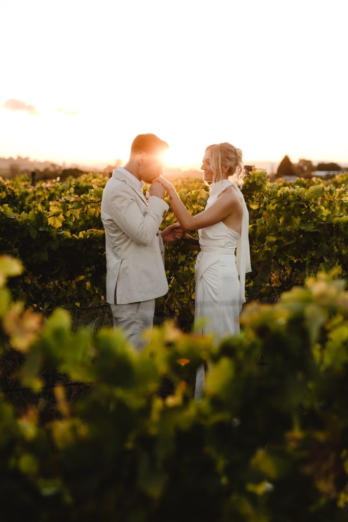 A couple sharing a moment among the Rochford vines