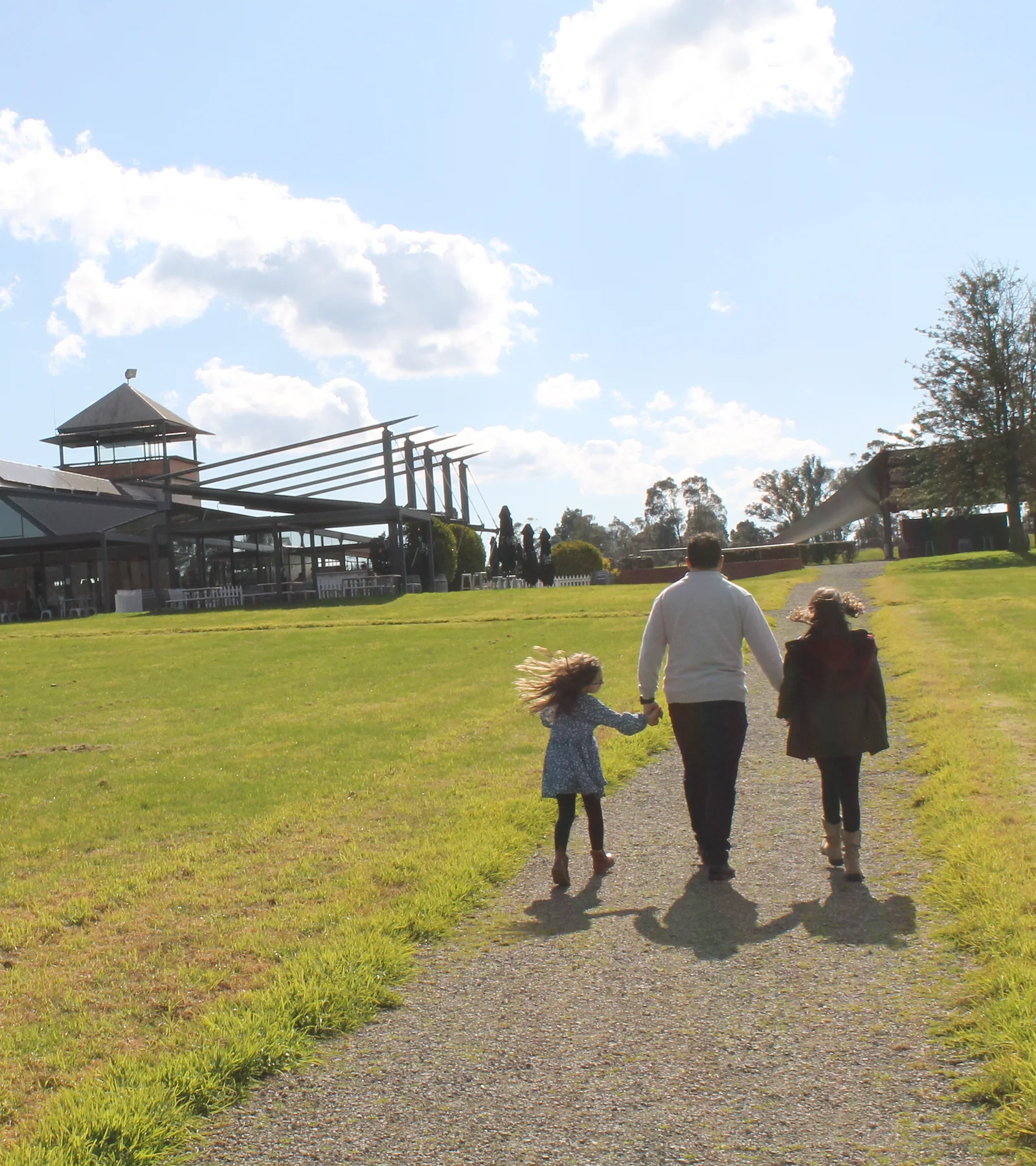 A family walking toward Rochford Wines